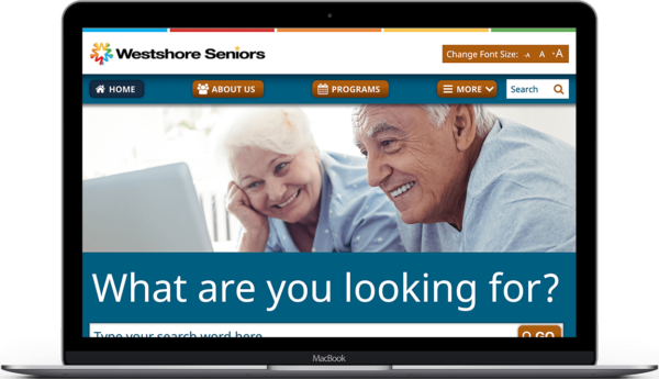 Westshore Seniors custom-coded responsive website on laptop.