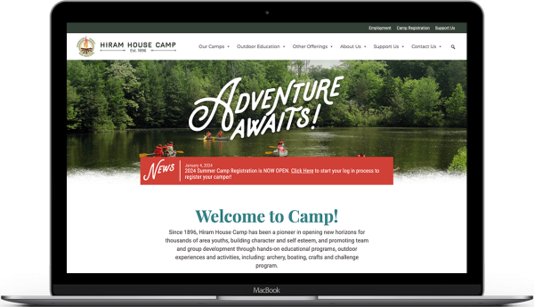 Hiram House Camp website design and accessibility edits on laptop.